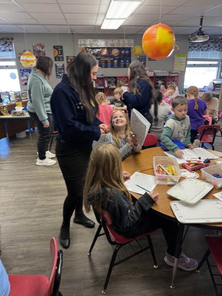 On Feb. 26, Santa Fe FFA Officer Julie Wieland helped in the 2nd grade room while presenting a Food for America activity as part of FFA Week at Santa Fe Elementary. Students were learning about soybeans and the many important by-products that soybeans provide us each day. (Submitted photo)