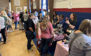 From left: Makenna Stephens, Conner Stephens and Heather Stephens work a booth during the Kid's Market day held in Concordia on May 23. (Santa Fe Times photo by Klarissa Olvera)